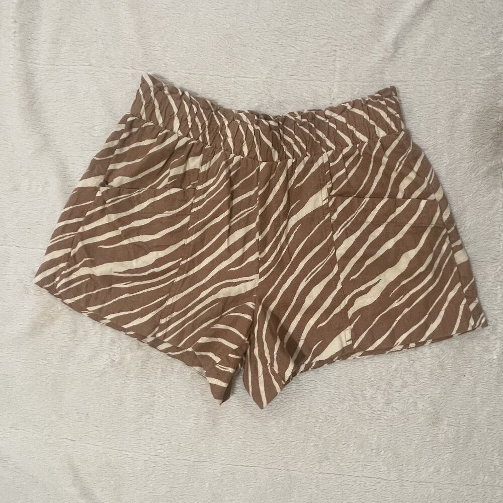 A New Day Giraffe print shorts in size small made of linen blend material